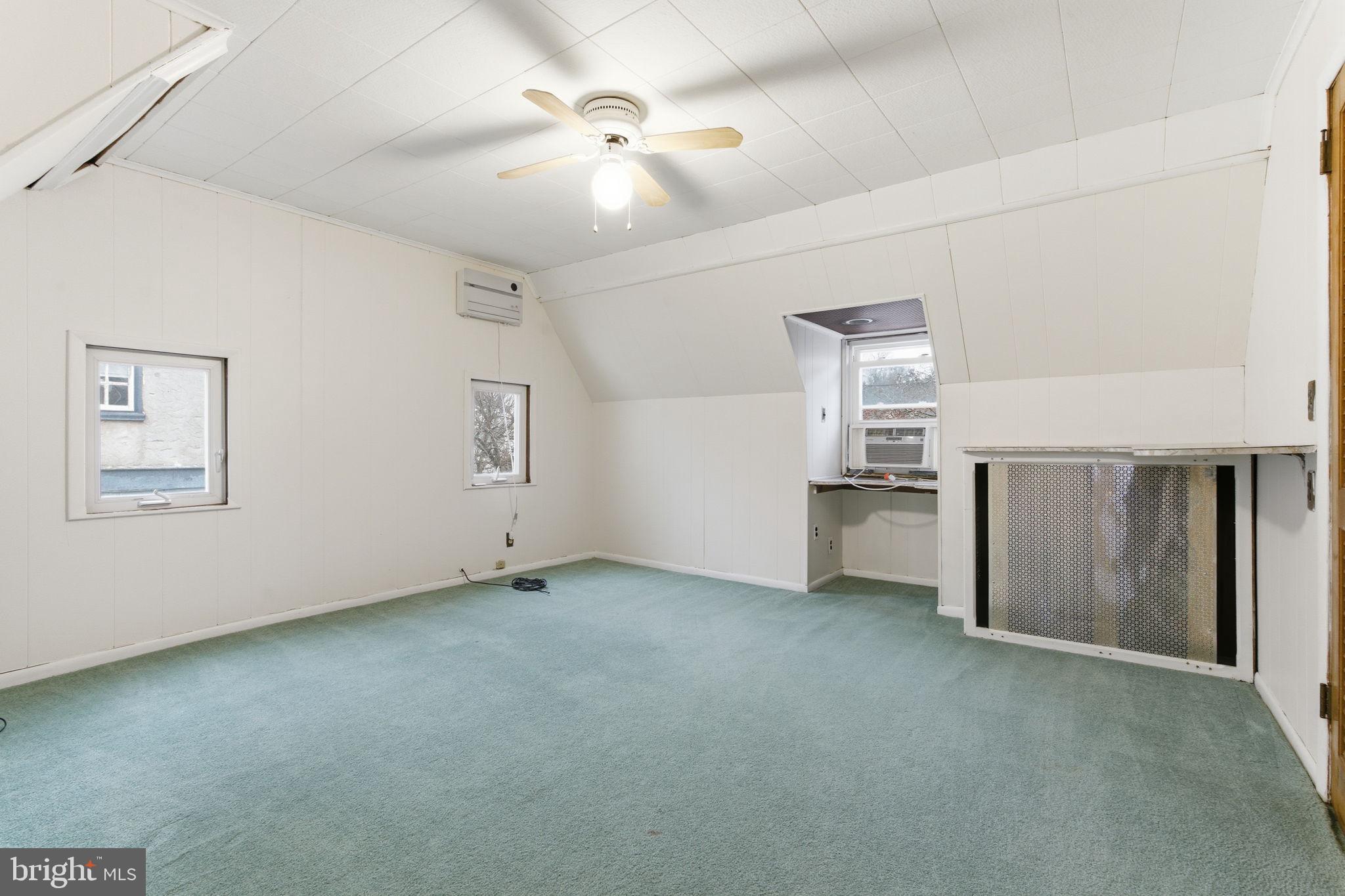 212 Upland Road Merion Station, PA 19066 - Photo 16 of 32 a view of empty room with a ceiling fan and window