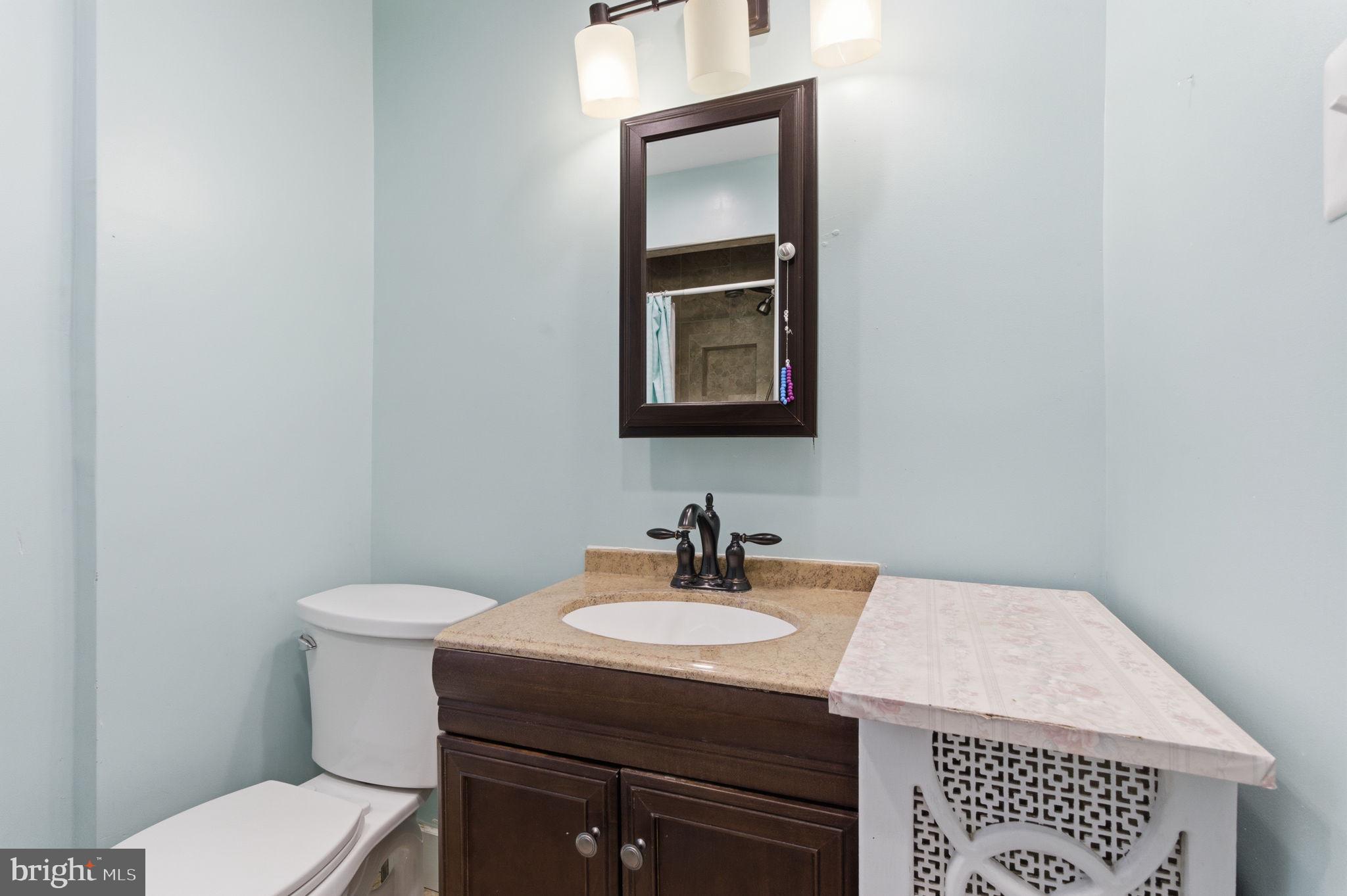 212 Upland Road Merion Station, PA 19066 - Photo 19 of 32 a bathroom with a sink toilet and mirror