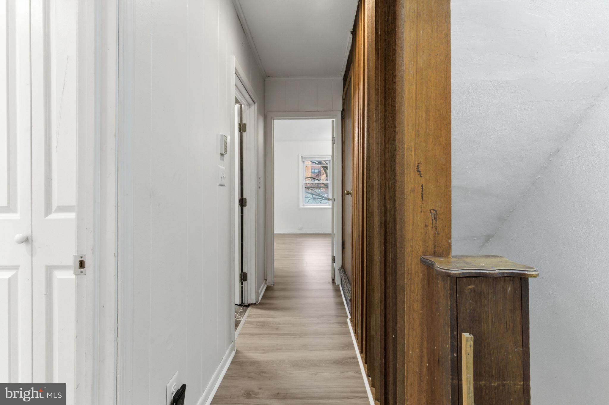 212 Upland Road Merion Station, PA 19066 - Photo 20 of 32 a view of a hallway with a wooden door