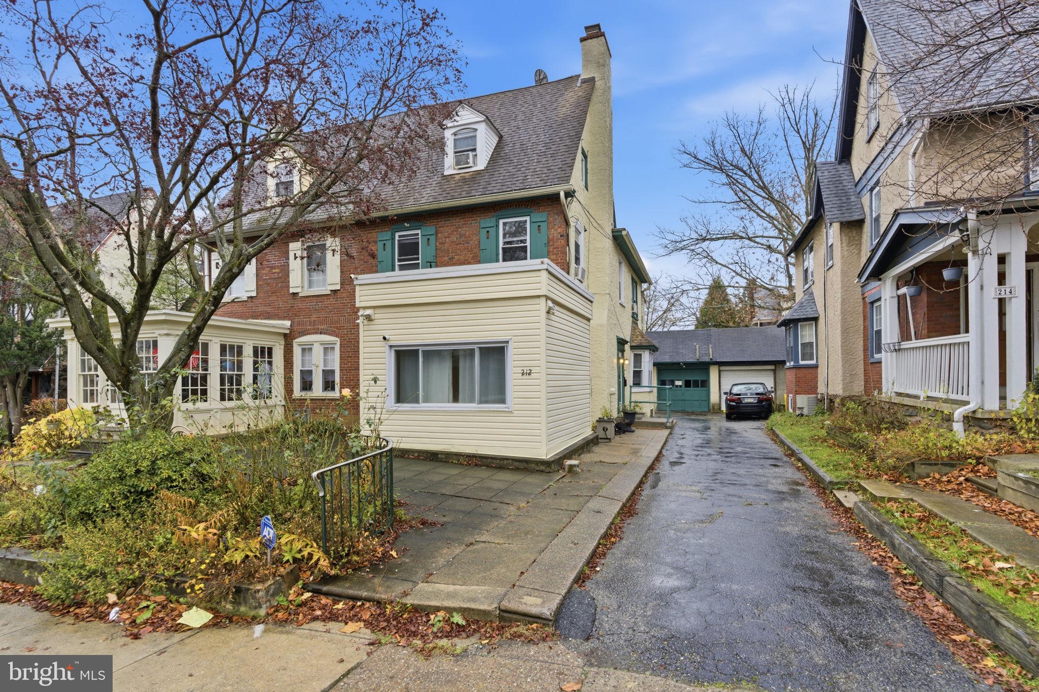 212 Upland Road Merion Station, PA 19066 - Photo 2 of 32 a front view of a house with garden