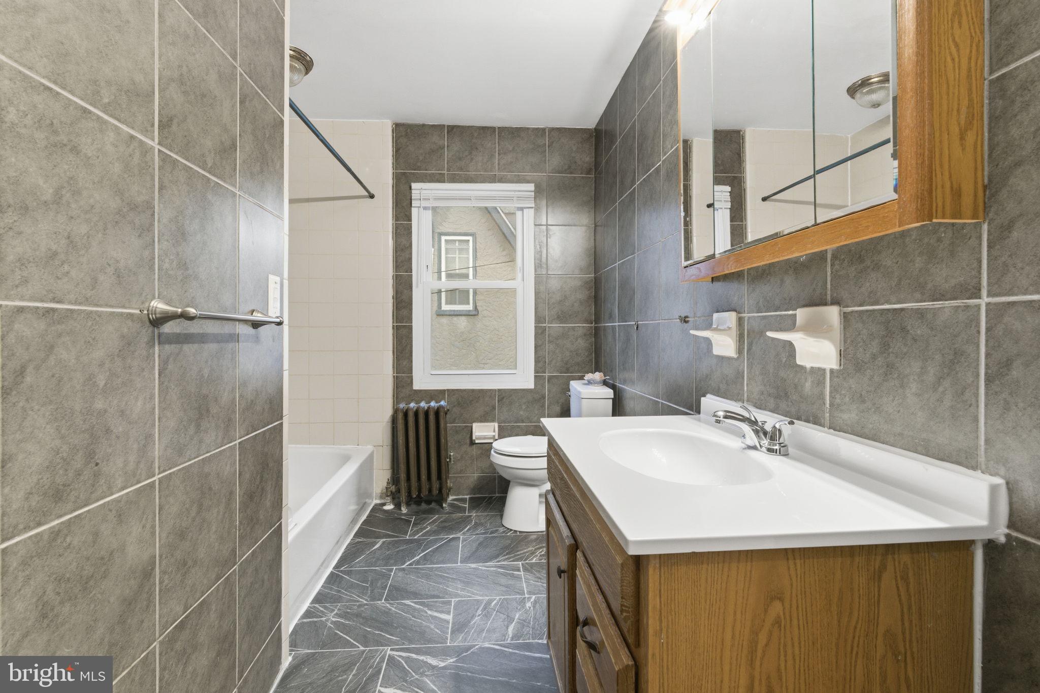 212 Upland Road Merion Station, PA 19066 - Photo 21 of 32 a bathroom with a sink and mirror