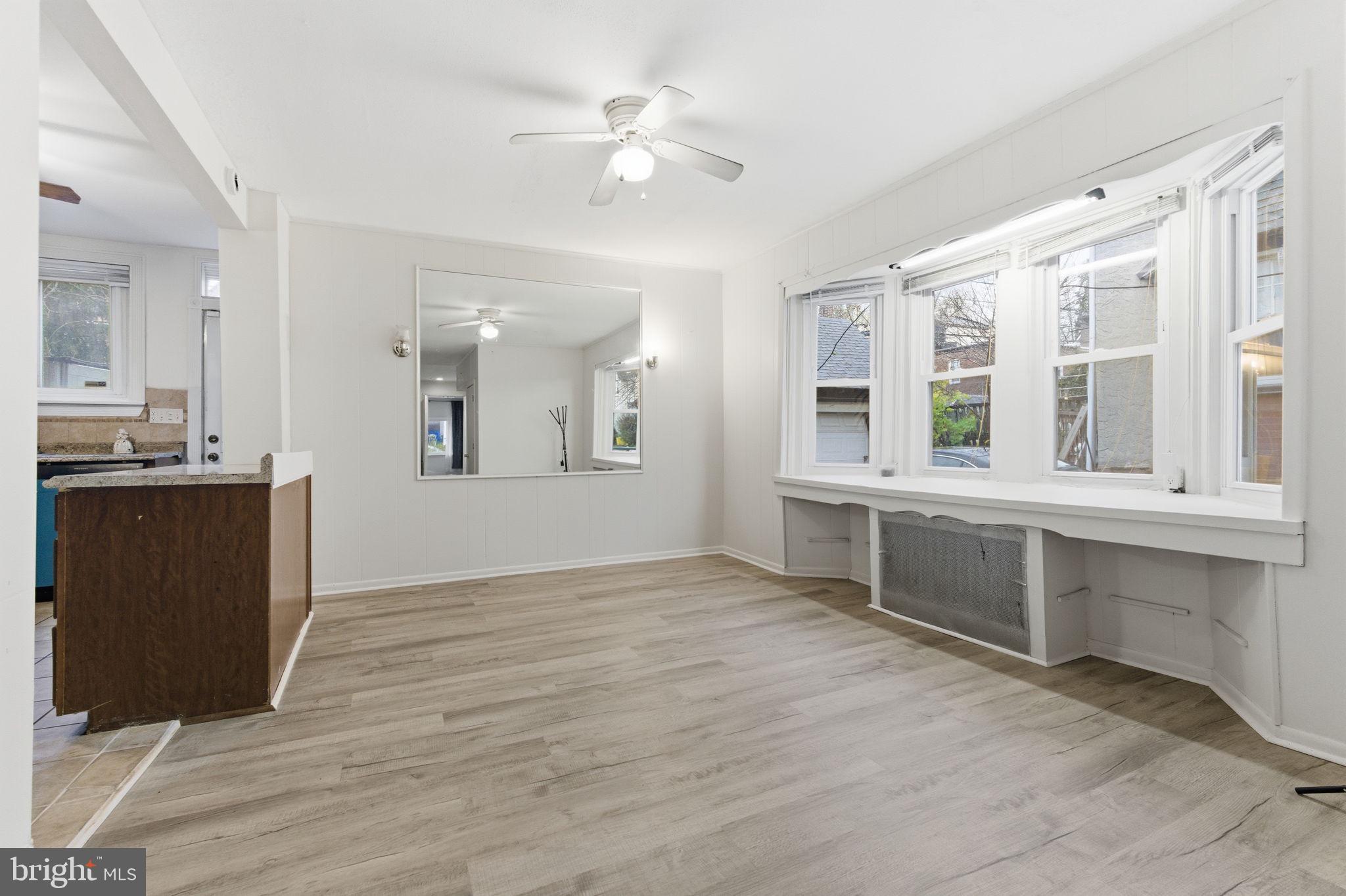 212 Upland Road Merion Station, PA 19066 - Photo 6 of 32 a view of an empty room with cabinet and a window