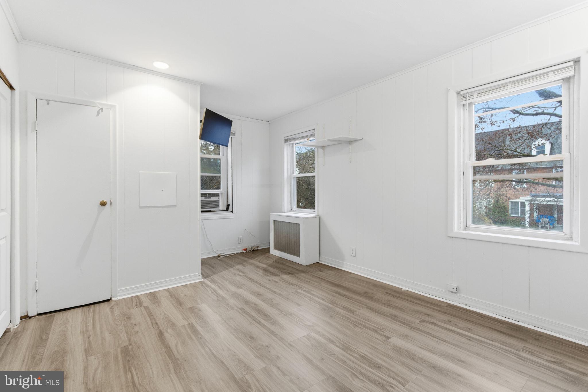 212 Upland Road Merion Station, PA 19066 - Photo 8 of 32 a view of empty room with wooden floor and fan