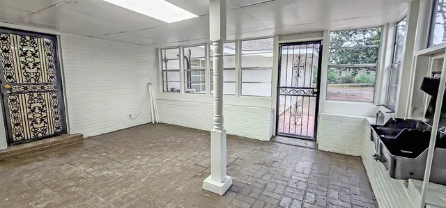 a view of an empty room with a fireplace
