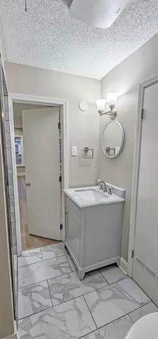 a view of a hallway with washer and dryer