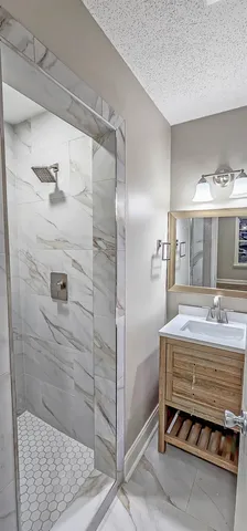 a bathroom with a tub and a shower
