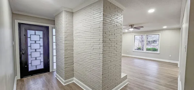 a view of entryway with wooden floor