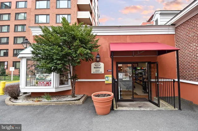 a view of a building with sitting area