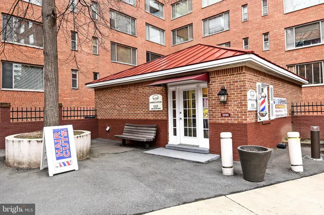 a front view of a building with parking