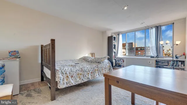 a living room with furniture and large window