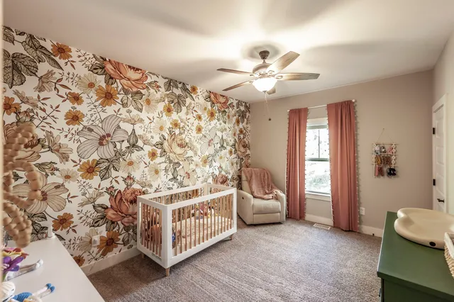 a living room with a couch and a chandelier