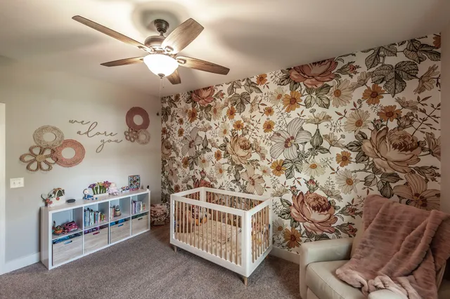 a bedroom with furniture and a chandelier