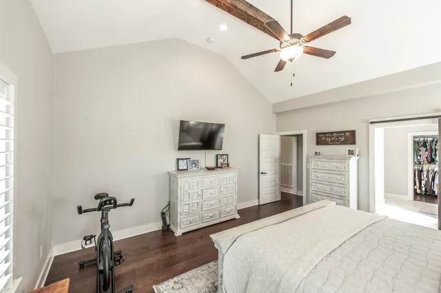 a spacious bathroom with a granite countertop sink and a mirror