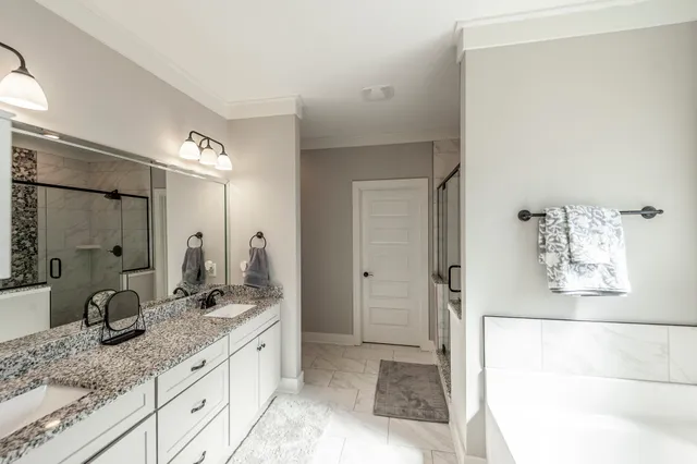 a bathroom with a bathtub and a shower