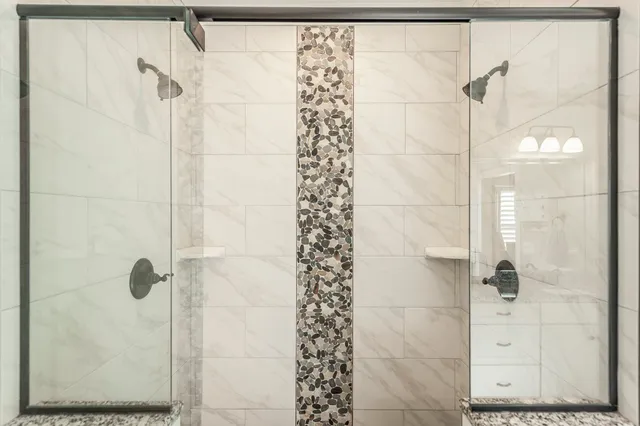 a view of walk in closet with clothes