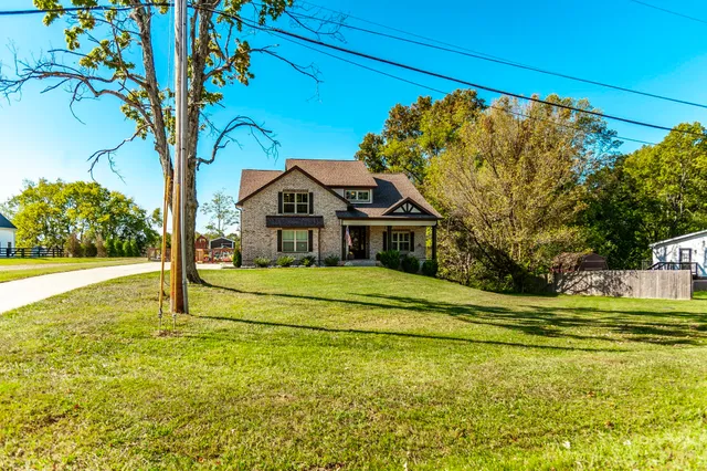 a front view of a house with a yard