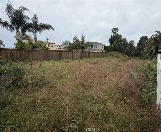 an aerial view of multiple houses with yard