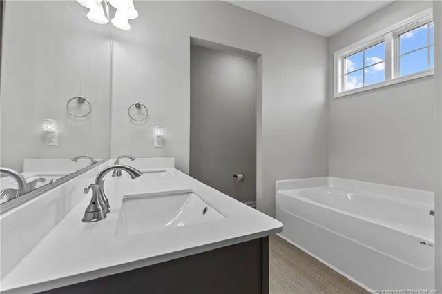 a white bath tub sitting in a bathroom