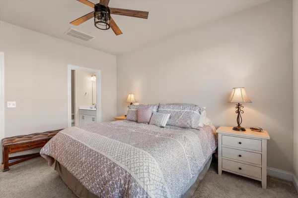 a bedroom with bed and window