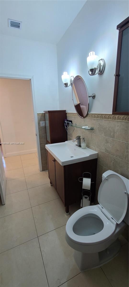 1721 Southwest 24th Terrace Miami, FL 33145 - Photo 38 of 80 a bathroom with a sink and a mirror