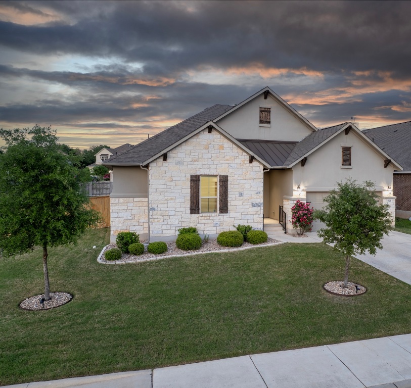 a front view of a house with a yard