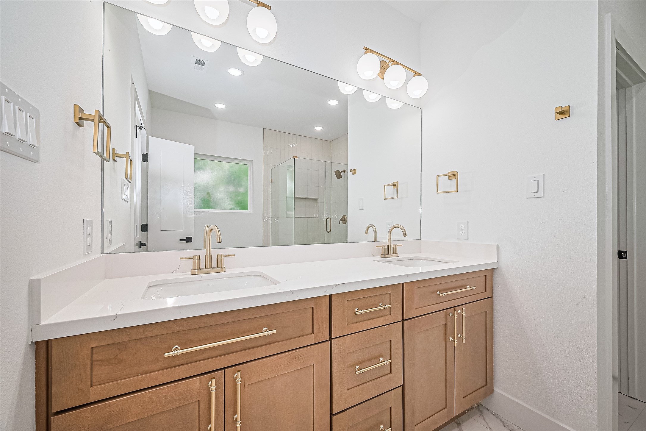 6023 Maybell Street Houston, TX 77091 - Photo 25 of 37 a bathroom with a sink vanity granite and a mirror