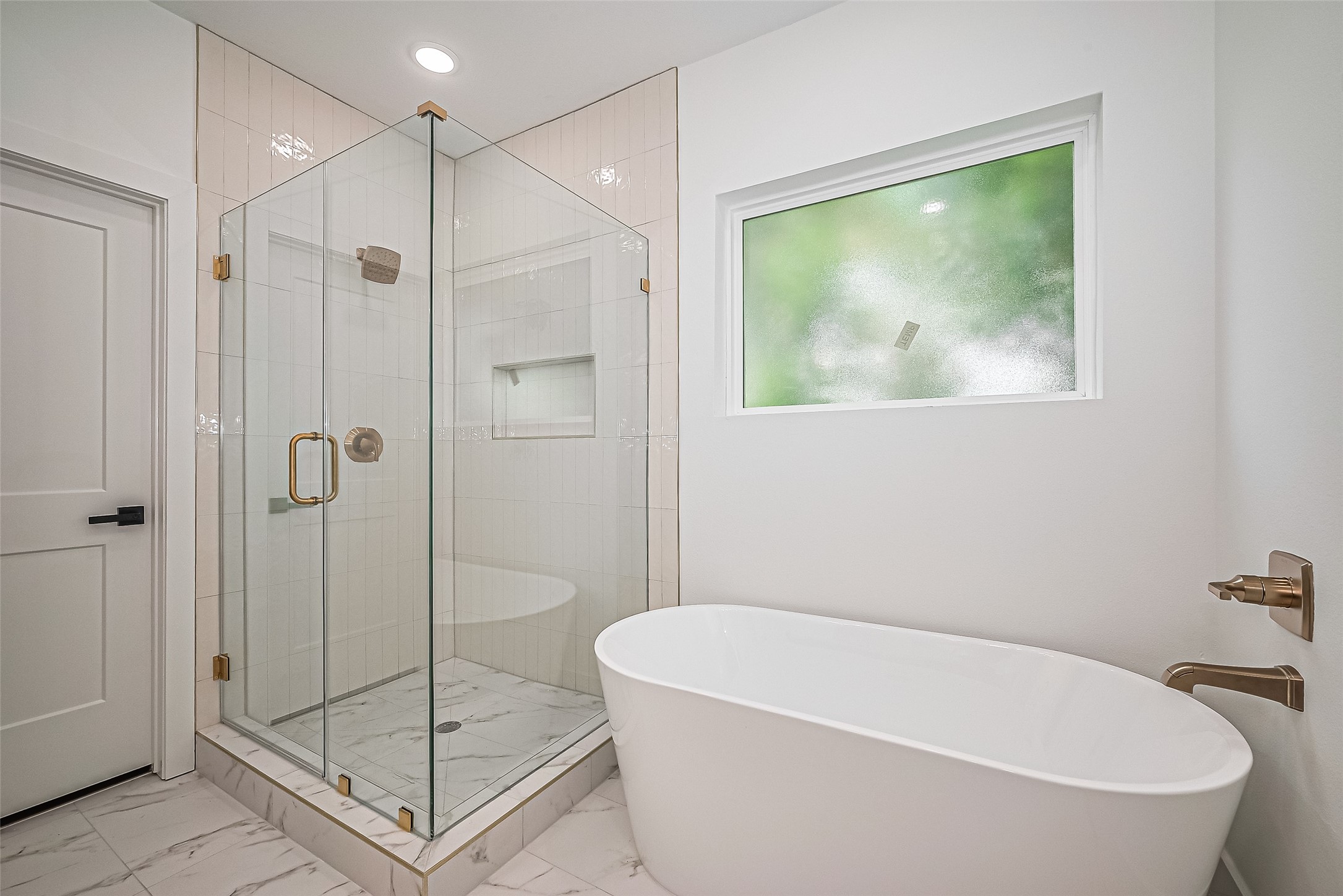 6023 Maybell Street Houston, TX 77091 - Photo 26 of 37 a bathroom with a bathtub and shower