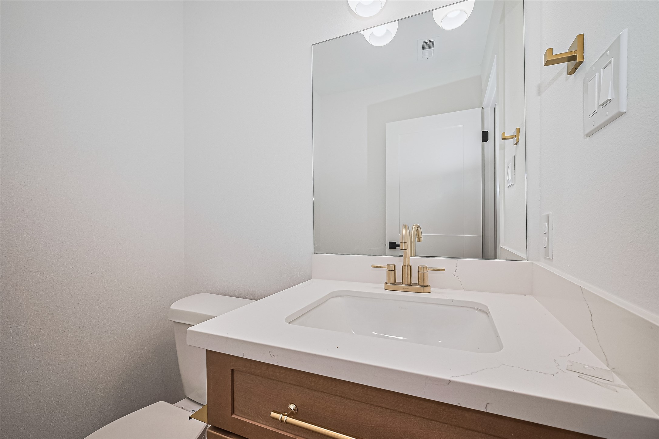 6023 Maybell Street Houston, TX 77091 - Photo 29 of 37 a bathroom with a sink a toilet and mirror
