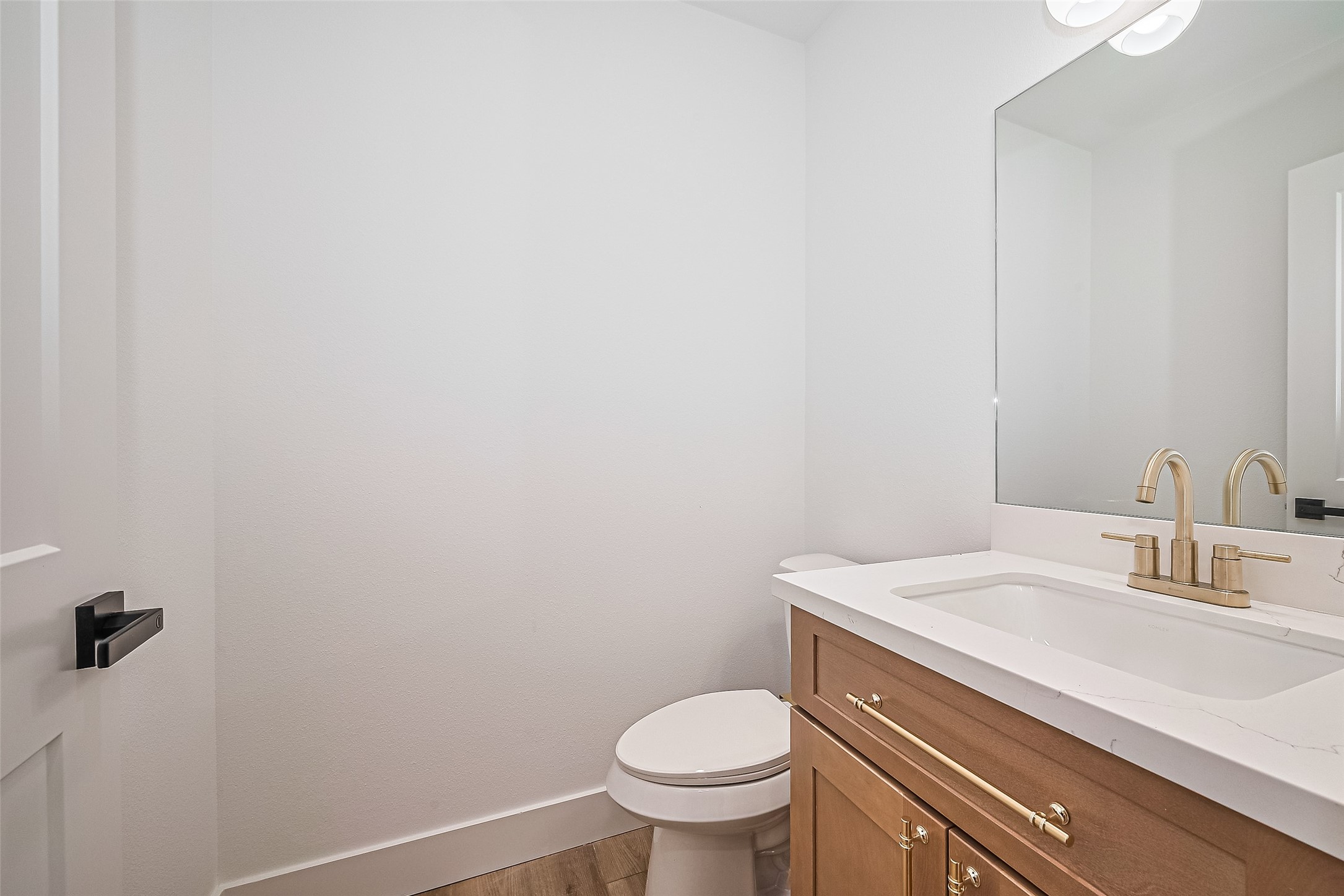 6023 Maybell Street Houston, TX 77091 - Photo 30 of 37 a bathroom with a granite countertop toilet and a sink