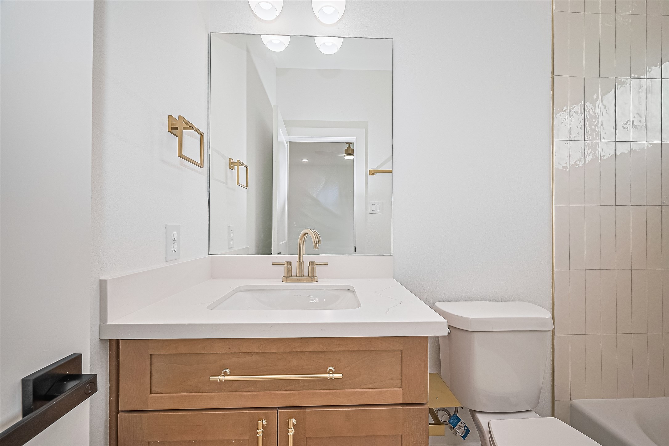 6023 Maybell Street Houston, TX 77091 - Photo 37 of 37 a bathroom with a sink toilet and mirror