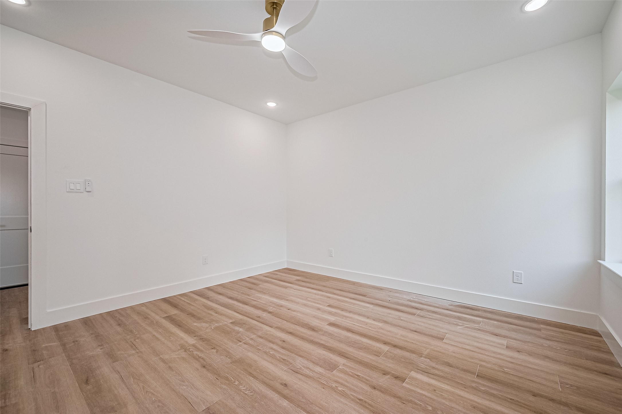6023 Maybell Street Houston, TX 77091 - Photo 4 of 37 wooden floor in an empty room