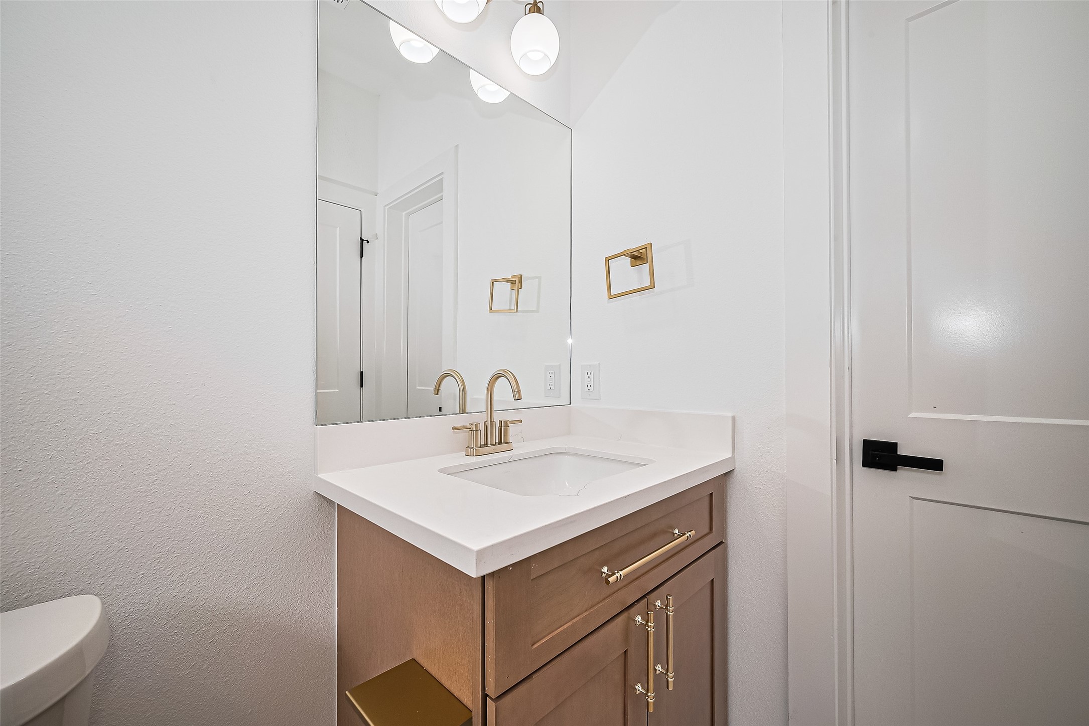 6023 Maybell Street Houston, TX 77091 - Photo 6 of 37 a bathroom with a sink and a toilet