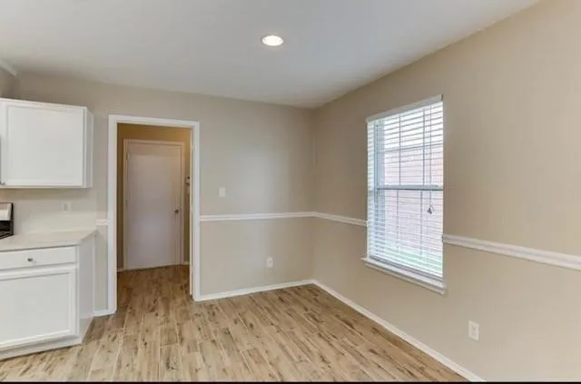 a view of kitchen with wooden floor