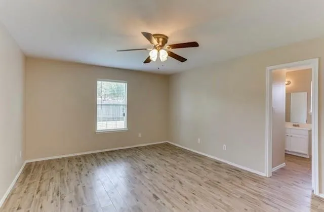 a bathroom with a sink and a window