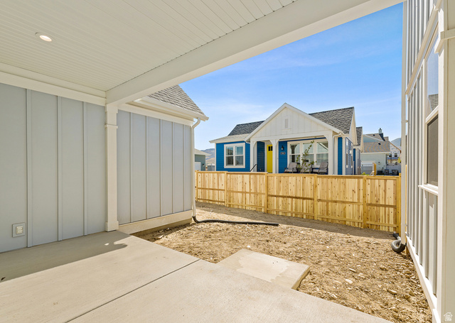 11214 South Easy Bee Road, Unit 270 South Jordan, UT 84009 - Photo 10 of 31 Concrete patio area with a covered porch ceiling, recessed lighting, and light blue vertical siding