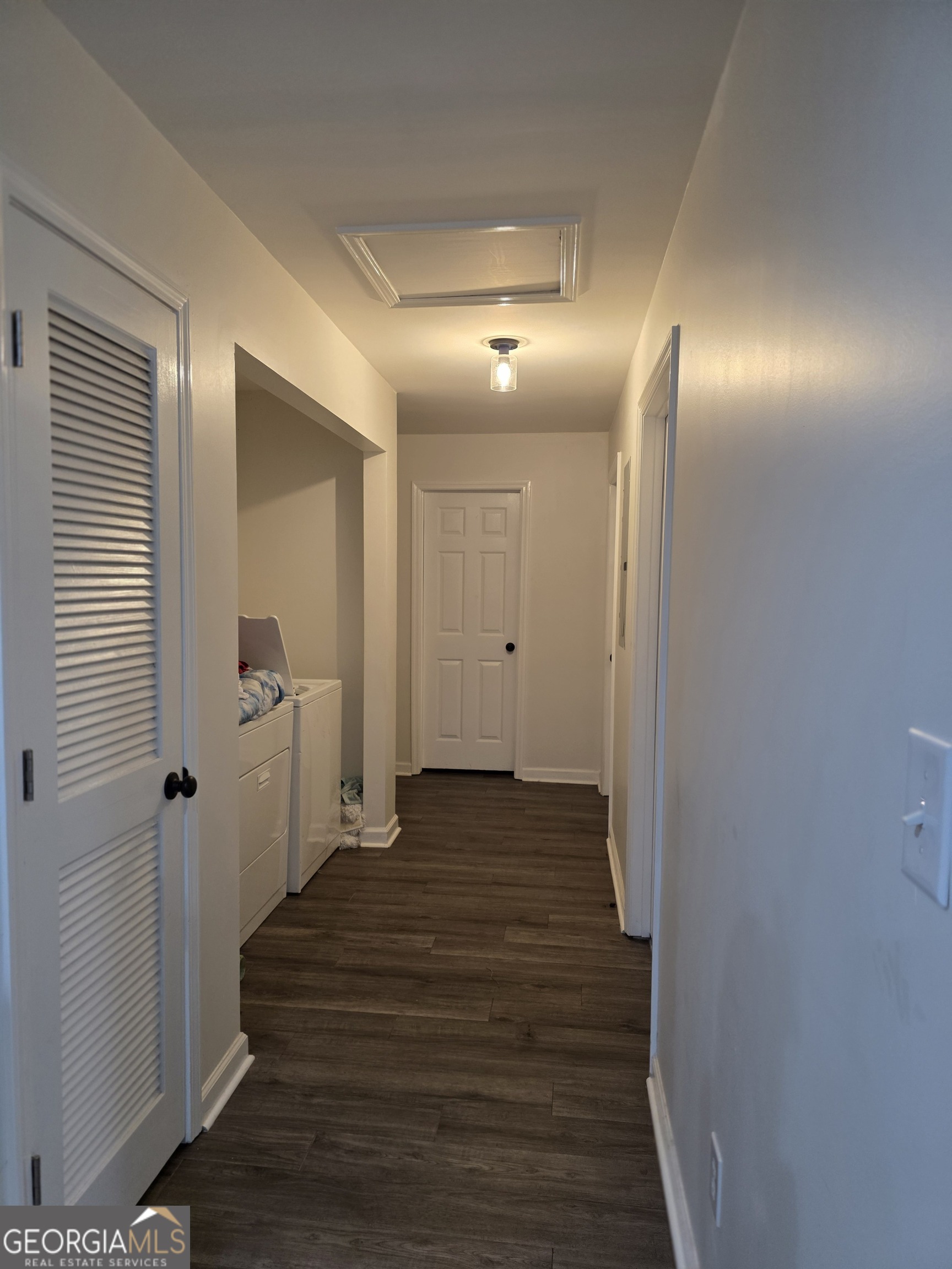 317 Preston Street Fort Valley, GA 31030 - Photo 3 of 7 a view of a hallway with wooden floor