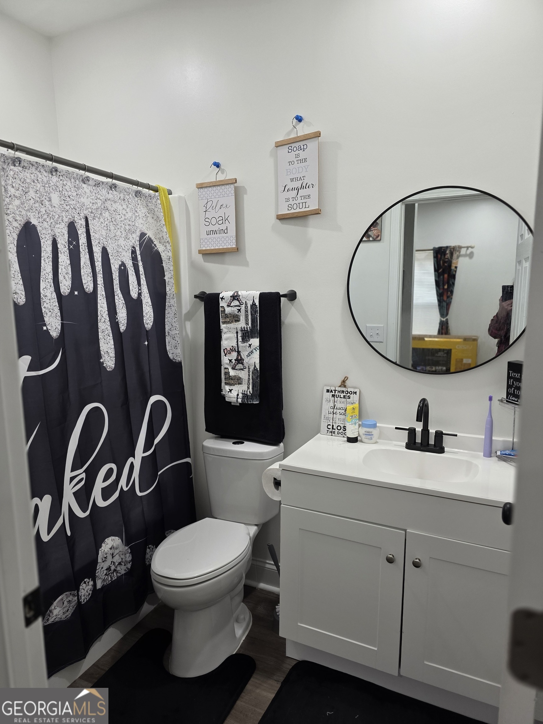 317 Preston Street Fort Valley, GA 31030 - Photo 6 of 7 a bathroom with a toilet sink and mirror