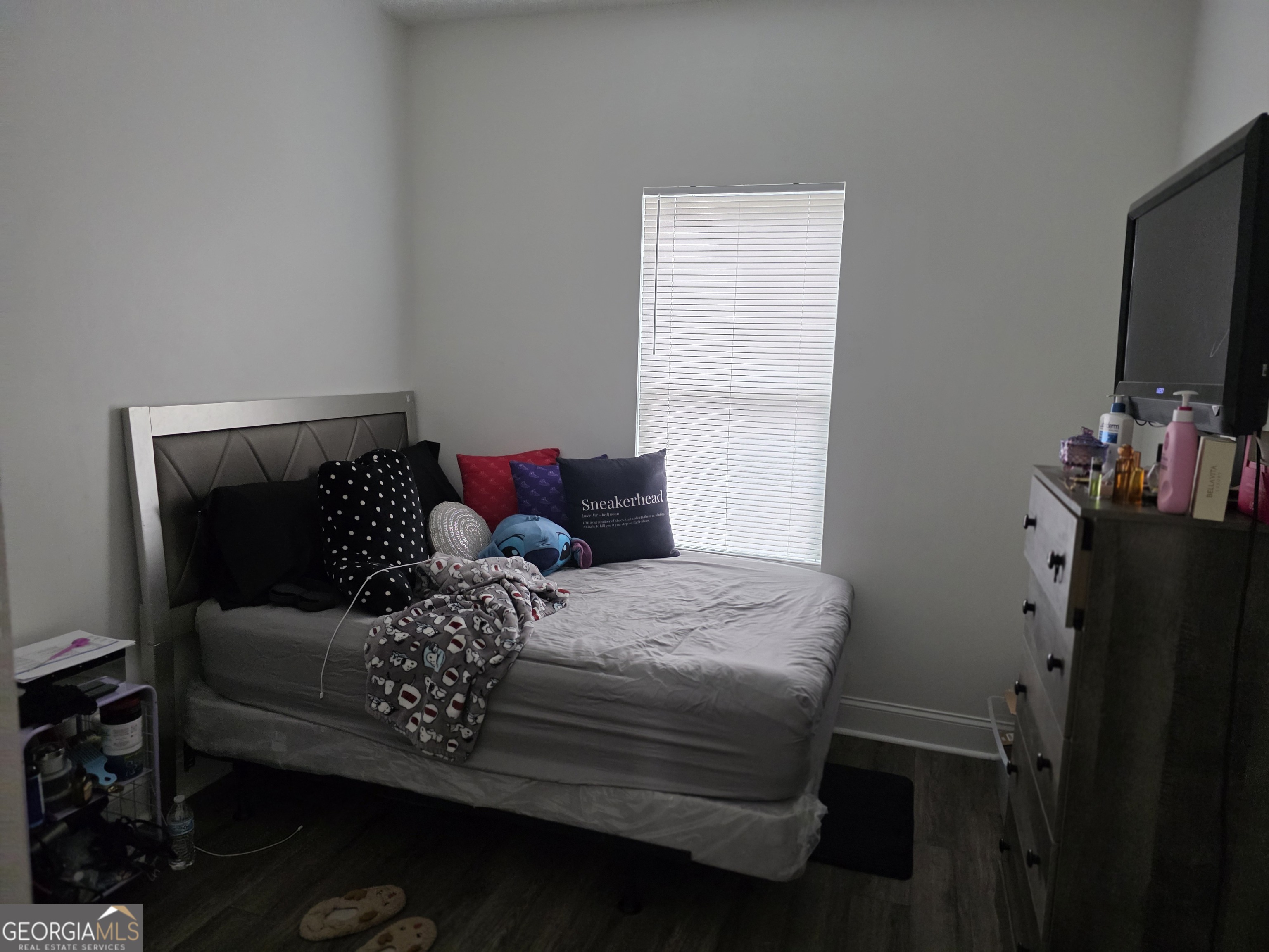 317 Preston Street Fort Valley, GA 31030 - Photo 7 of 7 a bedroom with a bed and a flat screen tv