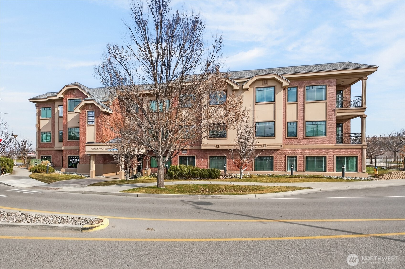 1 Fifth Street, Unit 110 Wenatchee, WA 98801 - Photo 1 of 13 a view of a building with a street