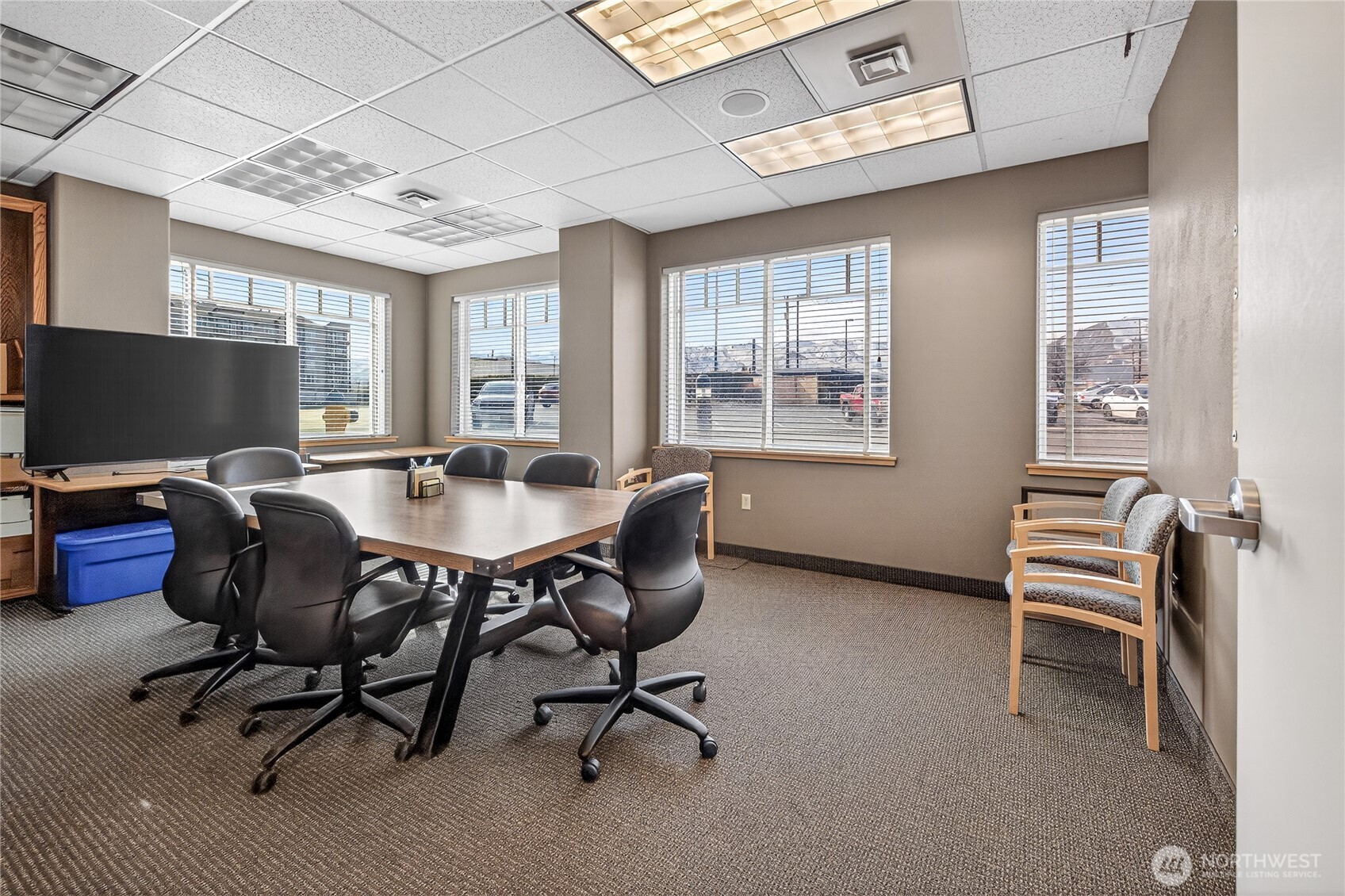 1 Fifth Street, Unit 110 Wenatchee, WA 98801 - Photo 11 of 13 a view of a workspace with furniture and a window