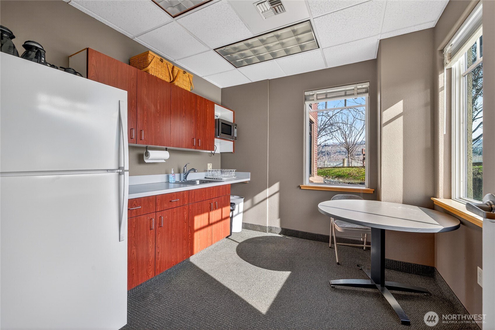 1 Fifth Street, Unit 110 Wenatchee, WA 98801 - Photo 13 of 13 a room with furniture a sink and a window