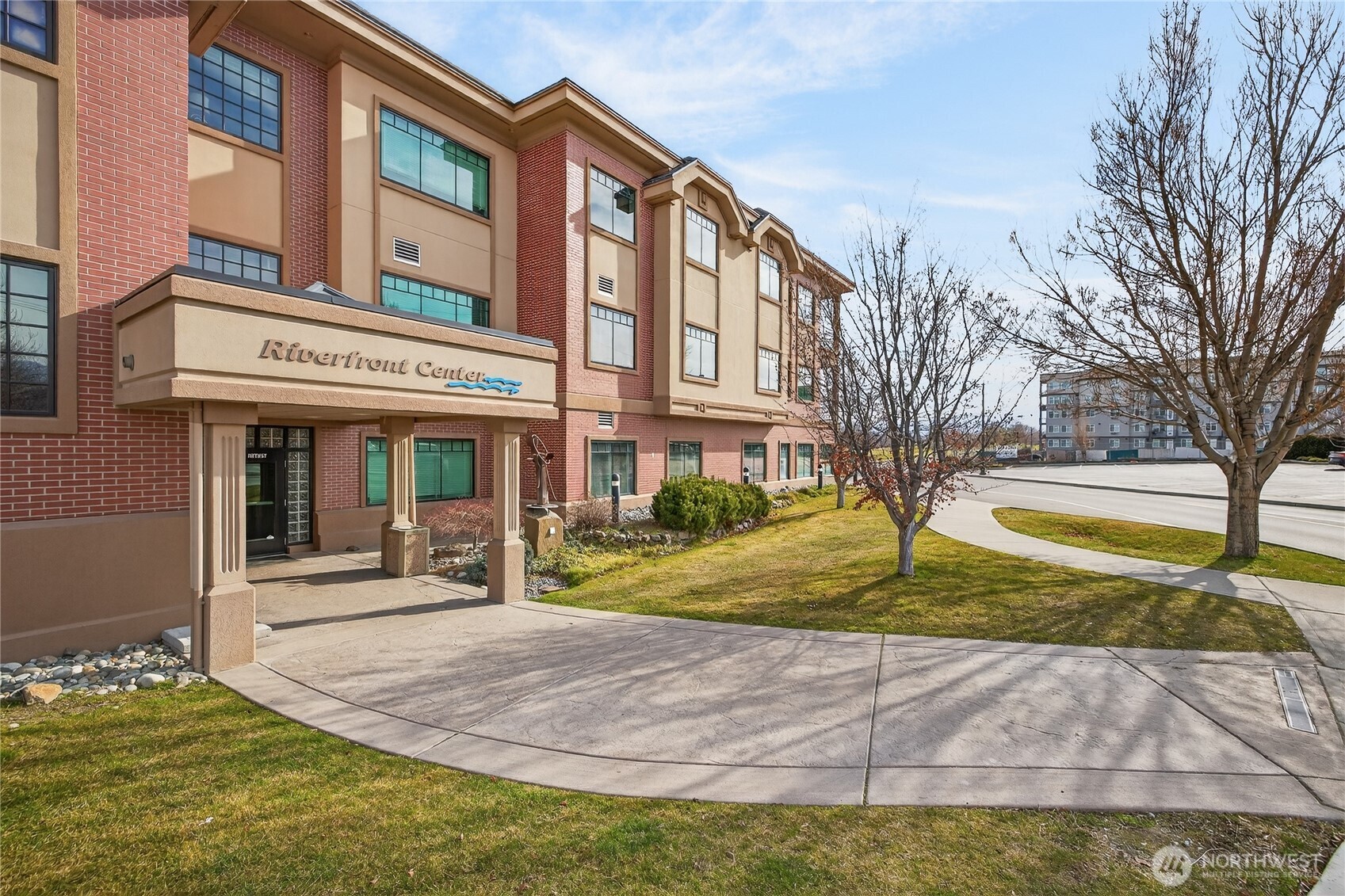 1 Fifth Street, Unit 110 Wenatchee, WA 98801 - Photo 2 of 13 a front view of a house with garden