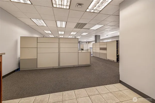 a kitchen with refrigerator and window