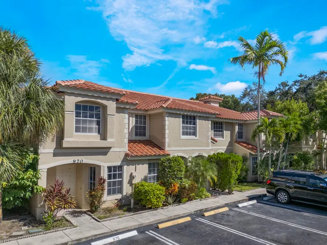 a view of a car park in front of a house