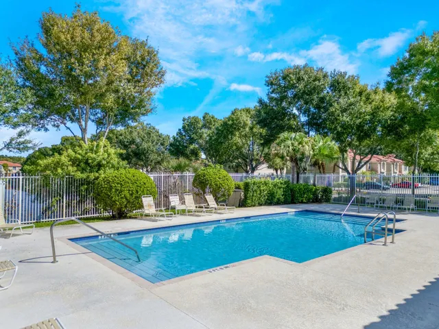 a view of a swimming pool with a patio