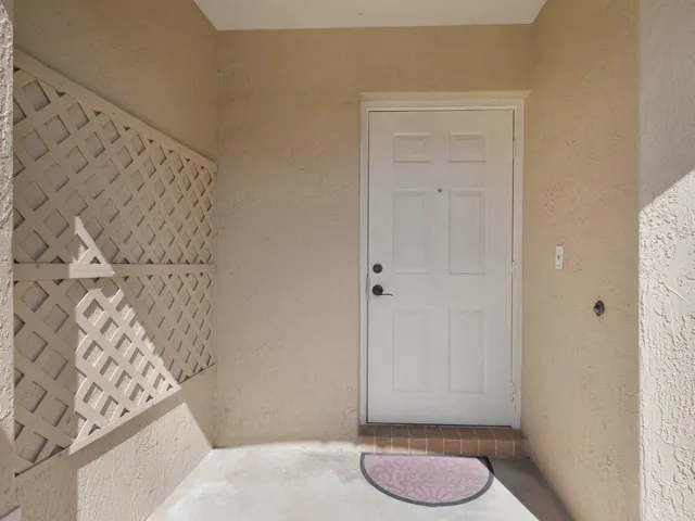 a bathroom with a granite countertop shower and a sink