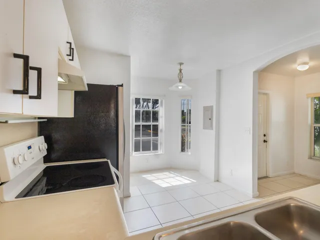 a kitchen with stainless steel appliances a refrigerator and a sink