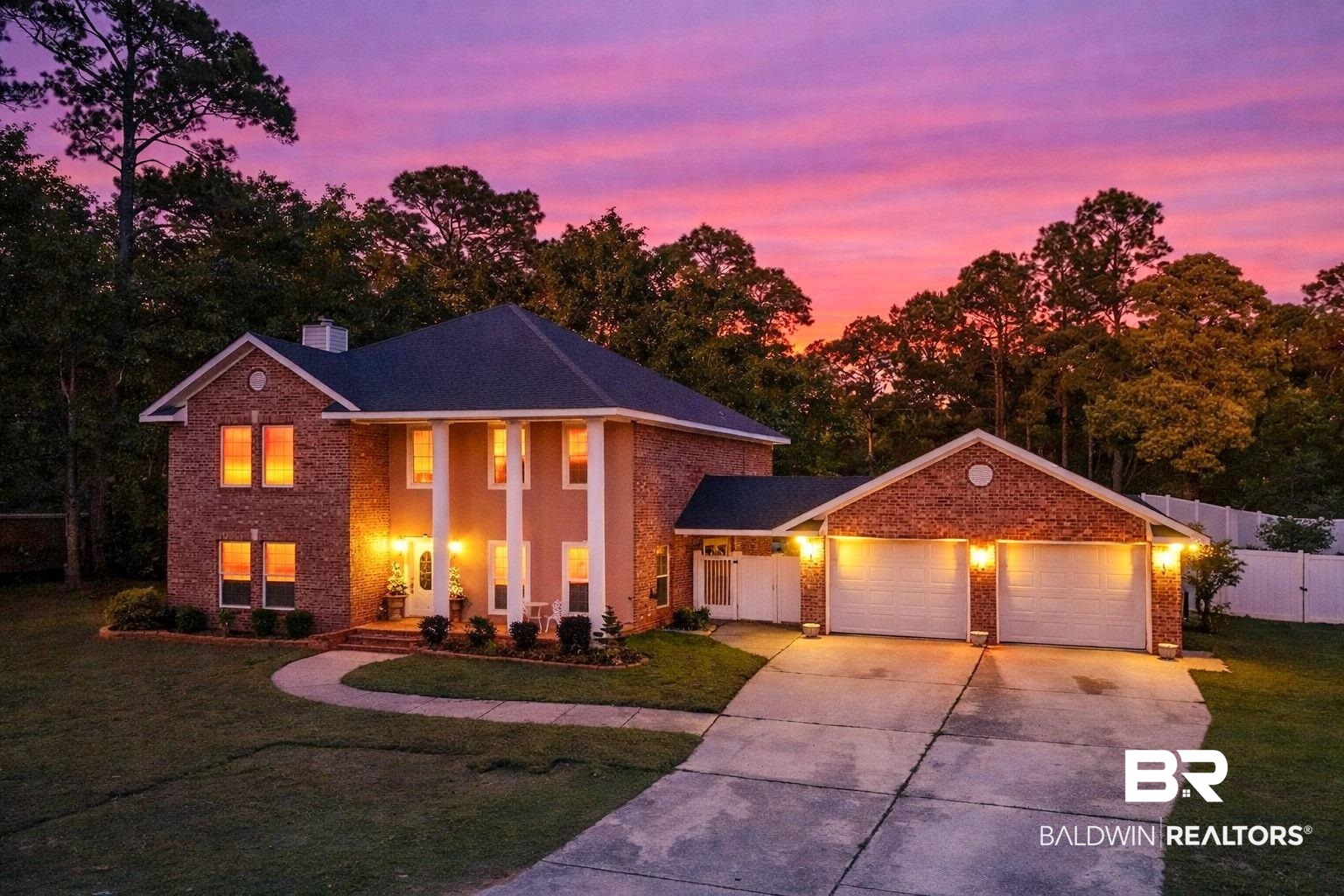 2 Speckle Trout Route Daphne, AL 36527 - Photo 1 of 61 View of front facade with driveway, an attached garage, covered porch, brick siding, and a chimney