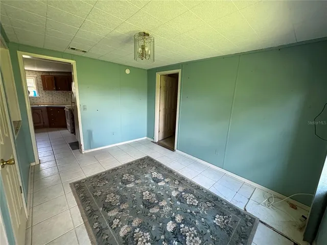 a view of a hallway to a bedroom