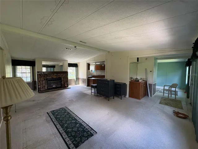 a kitchen with a sink a stove and cabinets